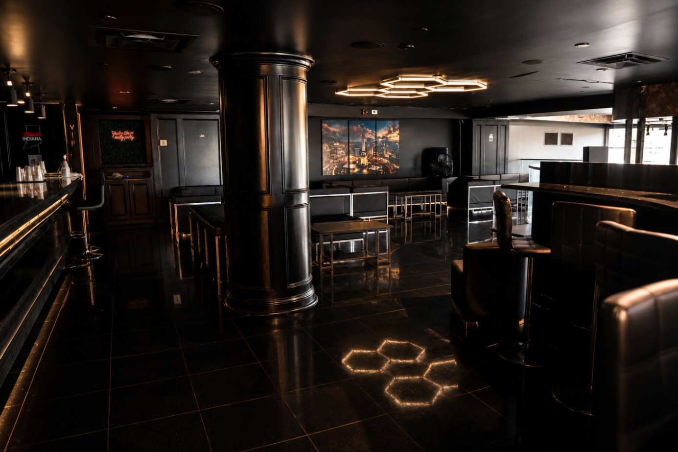 Inside Cross Ultra Lounge: black marble floors, low lighting and lounge seating